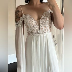 Ivory wedding dress with detachable wings